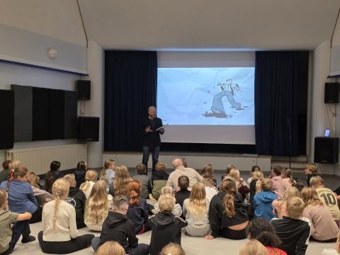 Students listen as Ævar presents his books